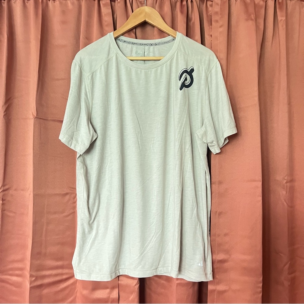 Solfire x Peloton light cream/grey cotton short sleeve crew neck logo tee